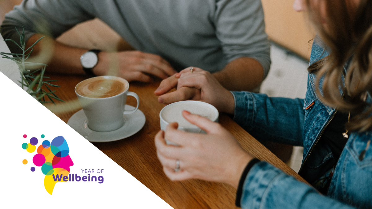 Two people have tea and a chat